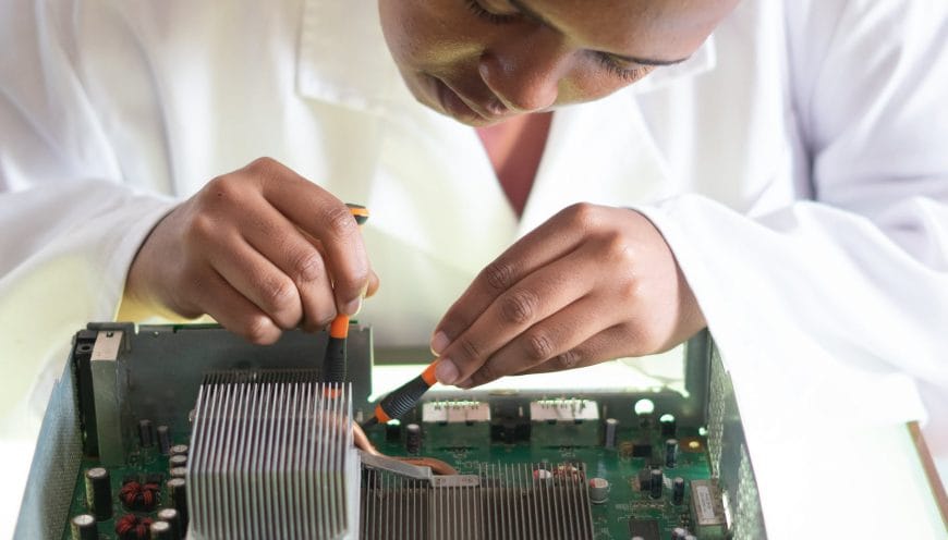 crop focused repairman fixing graphics card on computer